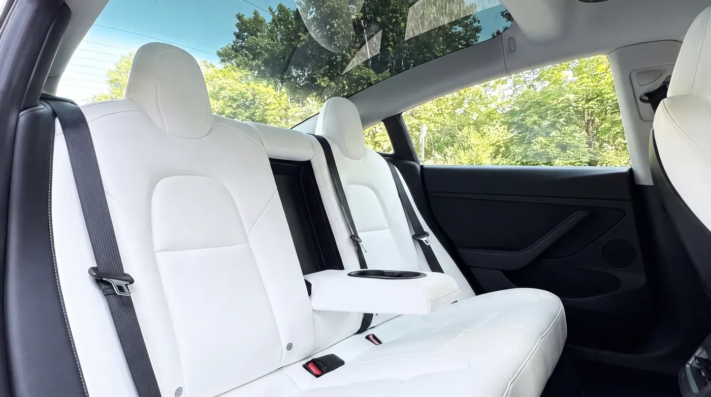 Black Tesla Model 3 and Mercedes EQE, interior view